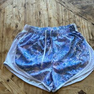 Size small ladies Nike DriFit lined running shorts. Light purple